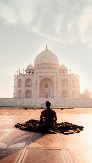 American Tourist Smiling in Front of Taj Mahal for Group Tours India